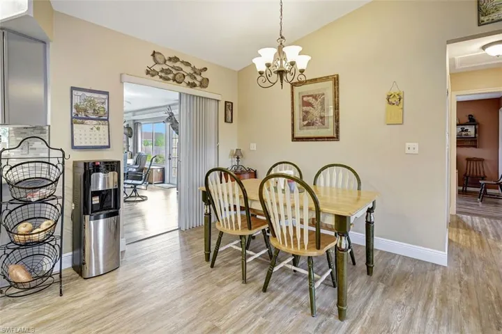 Dining space featuring an inviting chandelier and light hardwood / wood-style floors