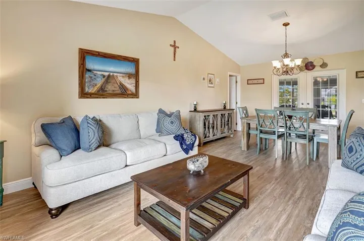 Living room with lofted ceiling