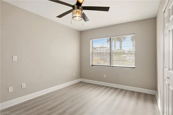 Neutral wall tones complemented by light wood-finish flooring