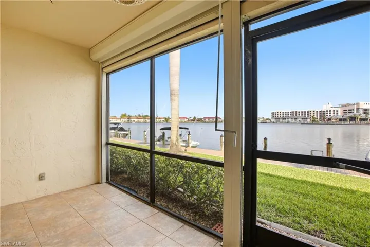 Screened lanai featuring water frontage with boat access