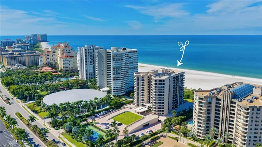 Coastal high-rise architecture with expansive beach frontage