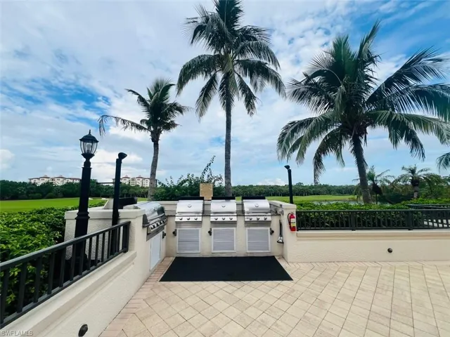 View of patio with a grill and an outdoor kitchen