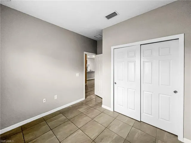 Neutral-toned walls and tile flooring