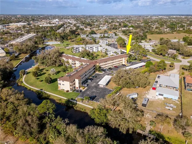 Aerial view featuring a water view and a residential view