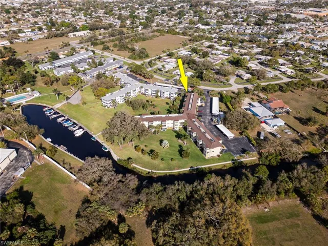 Drone / aerial view with a water view and a residential view