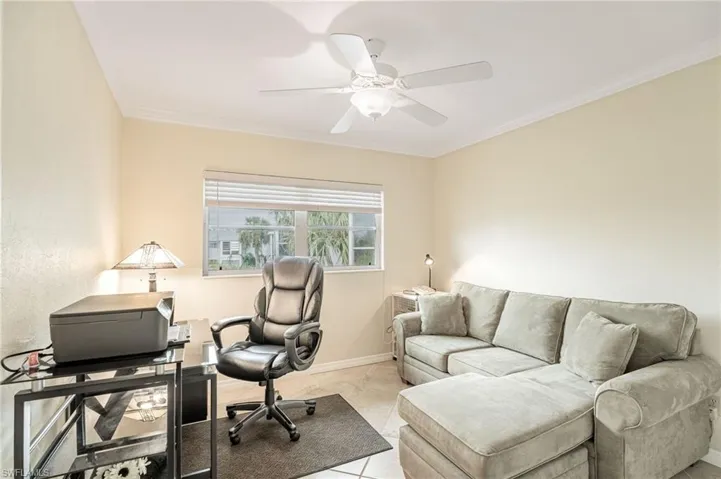 Guest Room or Den,  baseboards, a ceiling fan, and light tile patterned flooring
