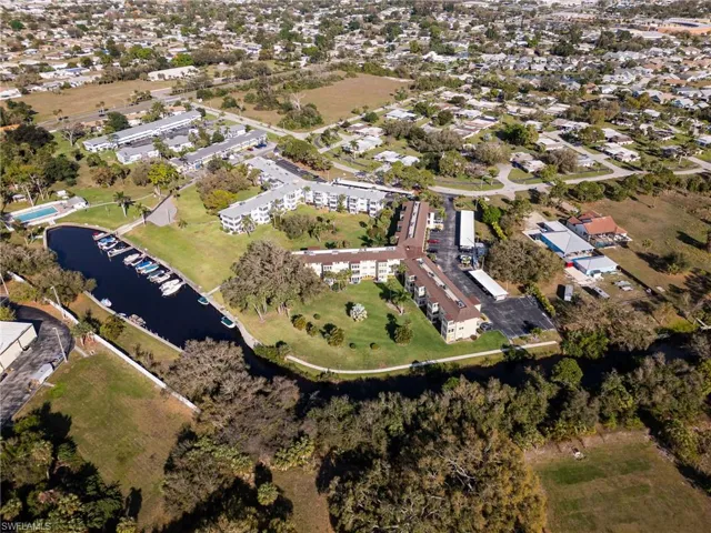 Aerial view featuring a residential view and a water view