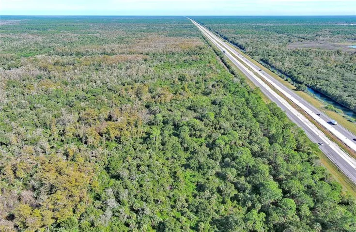 Aerial overview of property's location with a highway
