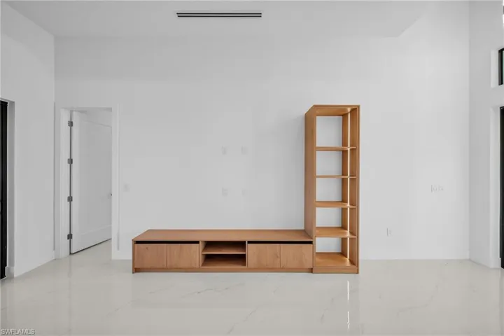 Empty room with light marble finish floors and baseboards