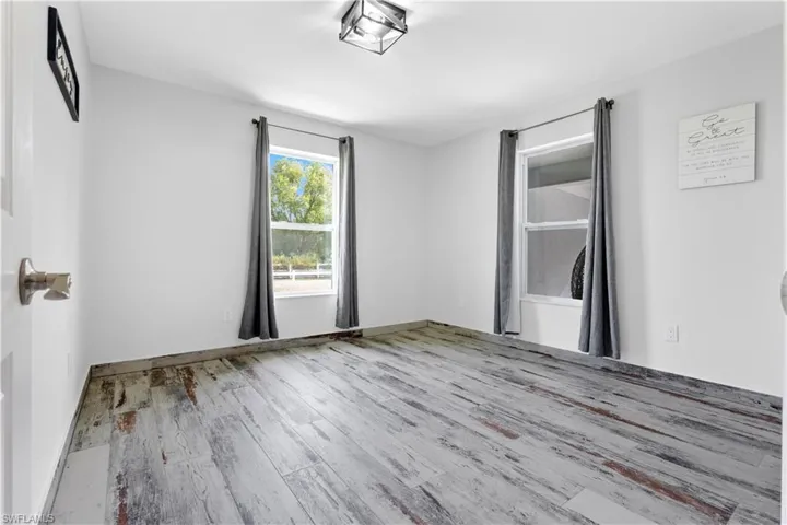 Spare room featuring hardwood / wood-style flooring