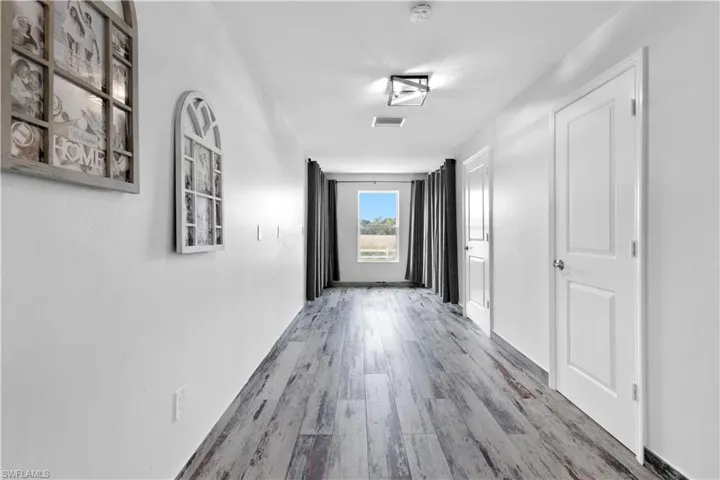 Hall featuring wood-type flooring