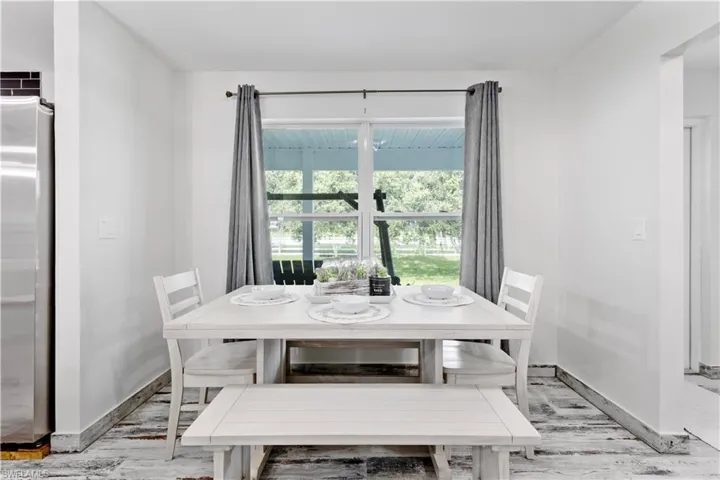 Dining space with light wood-type flooring