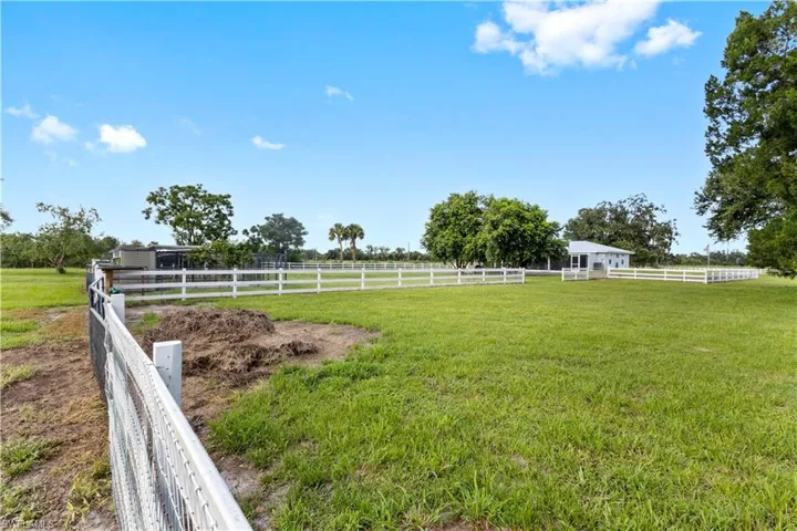 View of yard with a rural view