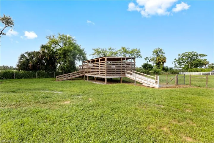 View of yard featuring a deck and a rural view