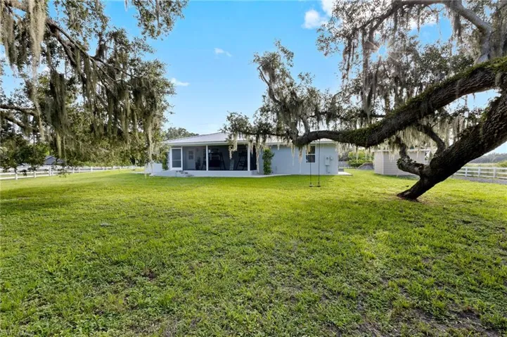 View of yard featuring a sunroom