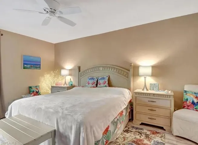 Bedroom with a ceiling fan and light wood finished floors