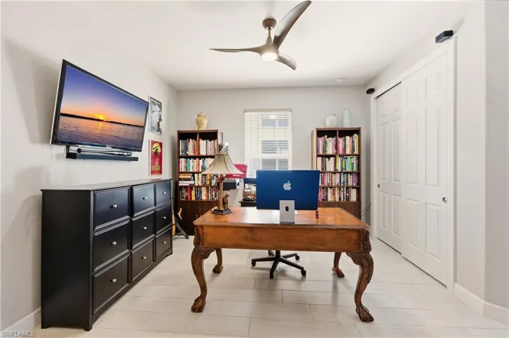 Office featuring baseboards and a ceiling fan
