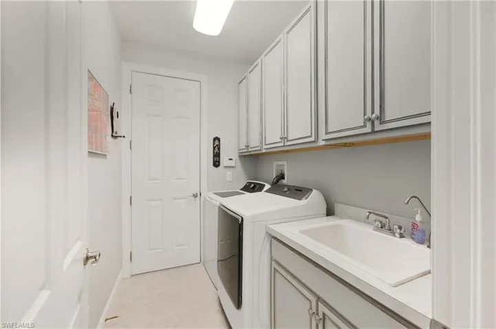 Laundry room with cabinet space and washer and dryer