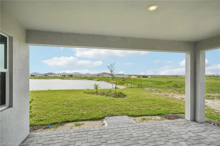 View of patio with a water view and a residential view