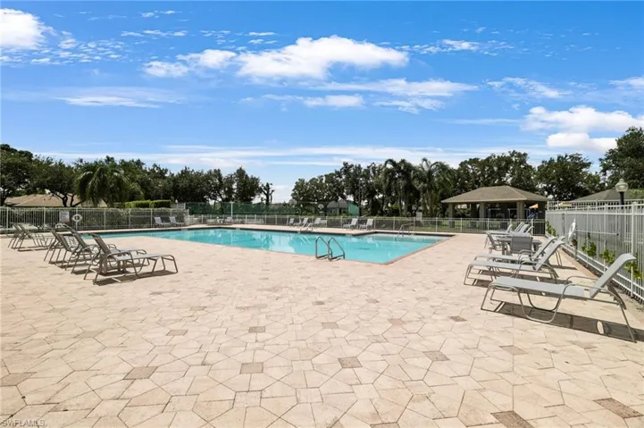 Community pool featuring a patio area