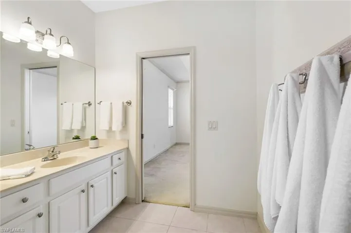Bathroom featuring vanity and tile patterned flooring