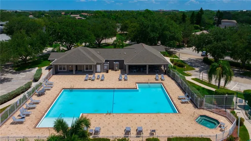Community pool with a community hot tub and a patio area