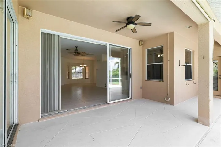 View of patio featuring ceiling fan