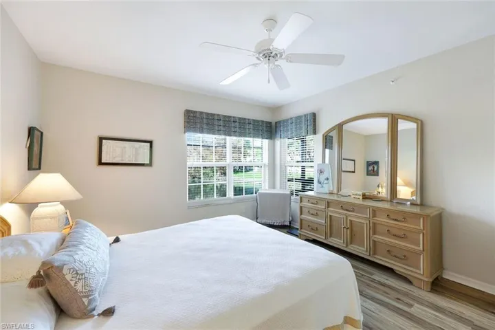 Bedroom featuring light hardwood / wood-style floors and ceiling fan