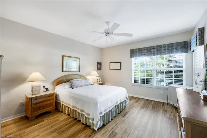 Bedroom featuring ceiling fan and light hardwood / wood-style floors
