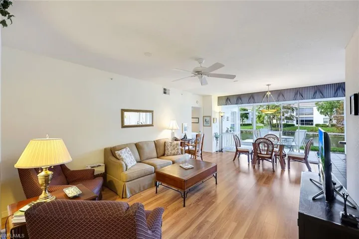 Living room overlooking dining, lanai and view of the pond