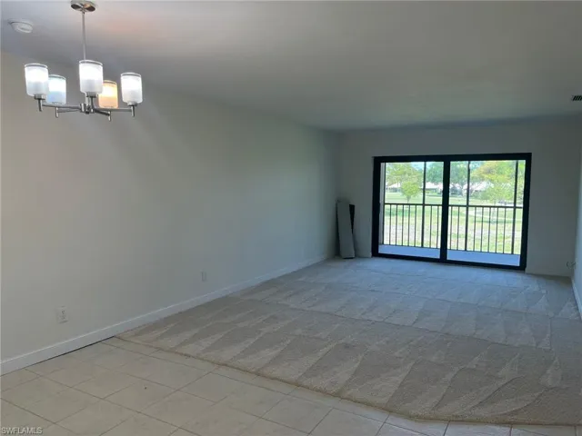 Living and Dining Room with Impact Resistant Doors to the Screened in Lanai