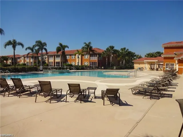 Community pool featuring a patio