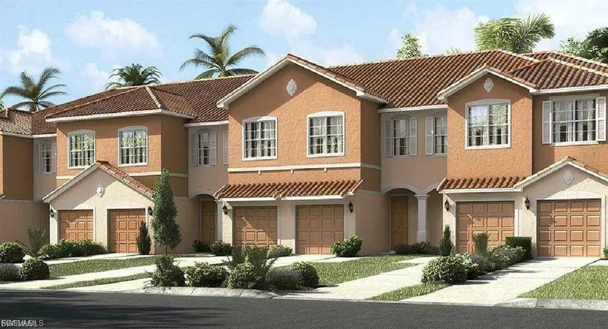 Mediterranean / spanish home featuring a tiled roof, stucco siding, and an attached garage