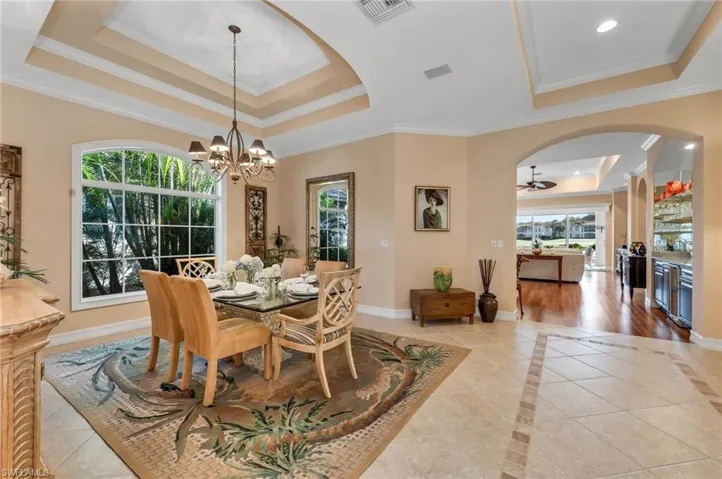 The dining room has high ceilings and generous crown molding.