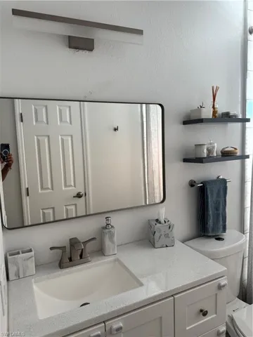 Bathroom with toilet and vanity