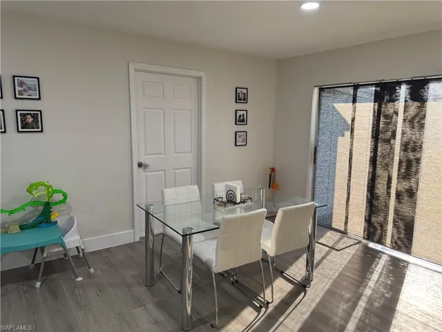 Dining space featuring wood finished floors and recessed lighting