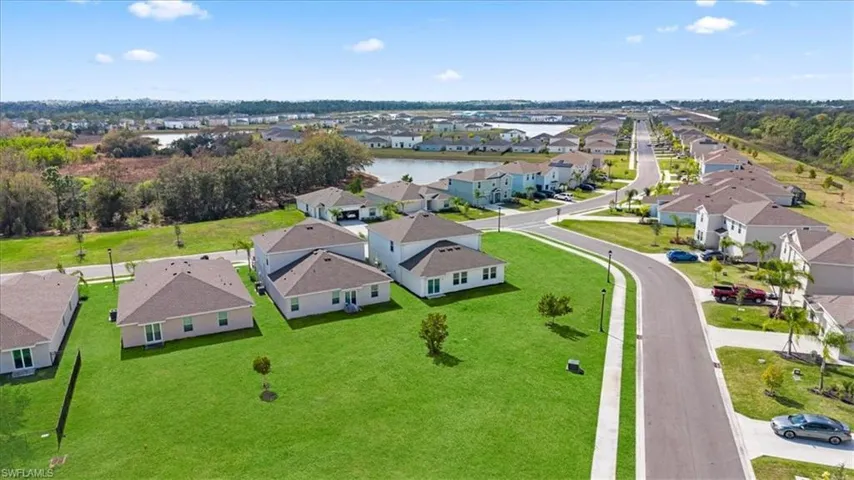 Aerial view of residential area with a large body of water