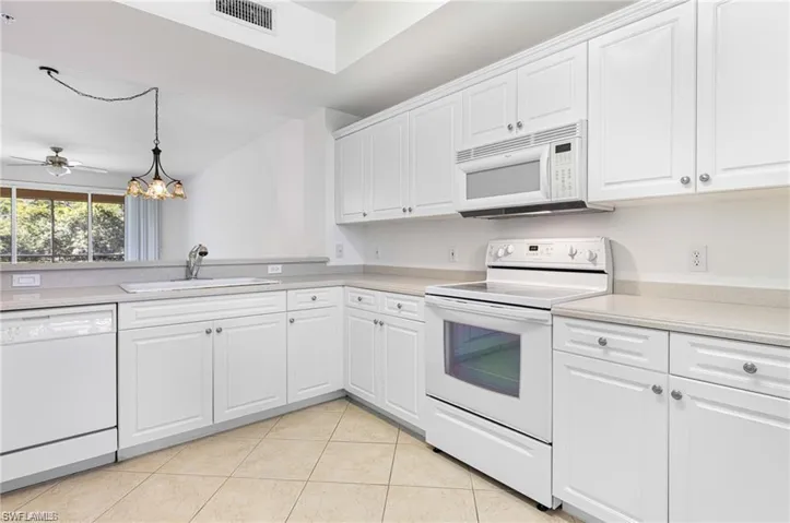 Kitchen with White Cabinets & Plenty of them!