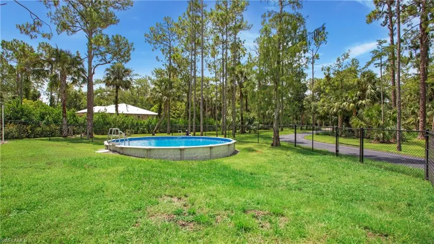 View of yard featuring view of wooded area