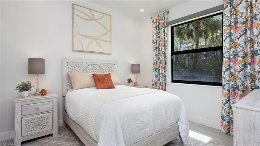 Bedroom featuring wood finished floors and recessed lighting