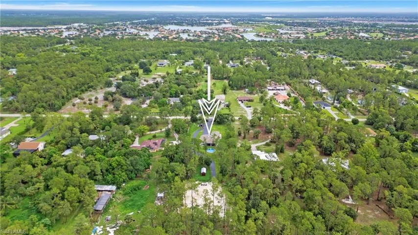 Aerial overview of property's location with a forest