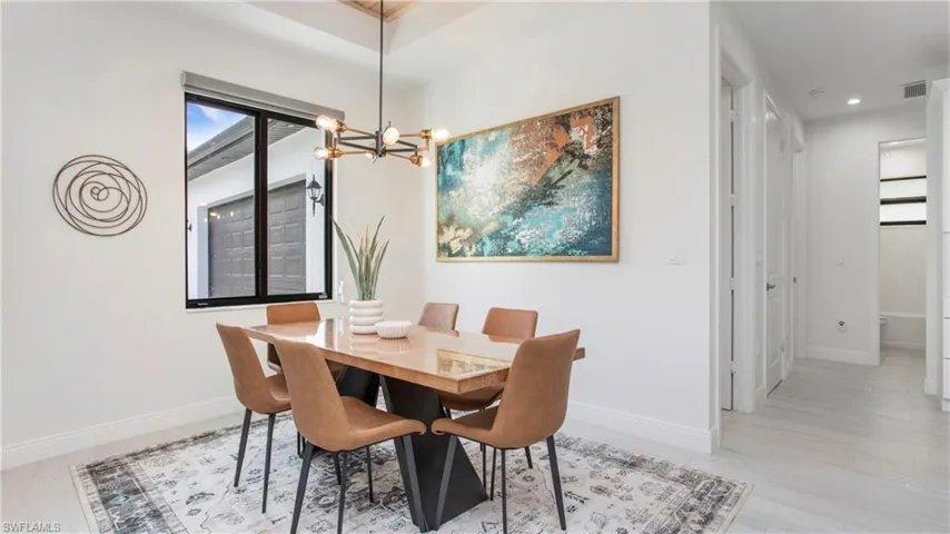 Dining room featuring a chandelier and recessed lighting