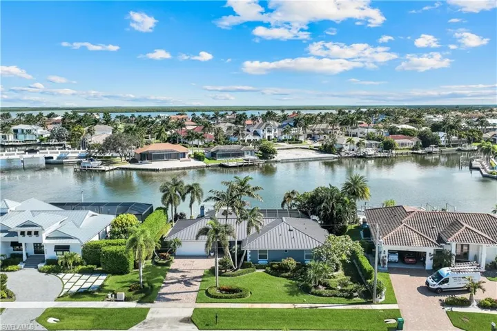 Aerial view of residential area with a large body of water