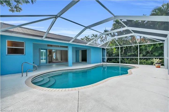 View of pool featuring a lanai and a patio