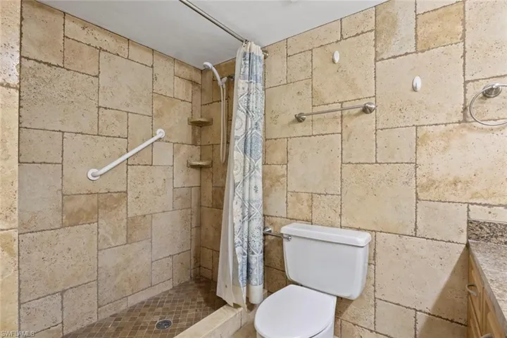 Bathroom with a stall shower and vanity