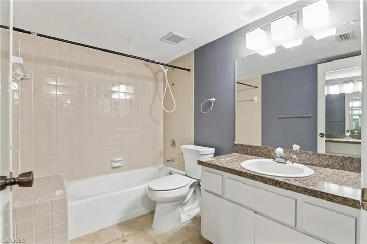 Full bath featuring vanity and shower / bathtub combination