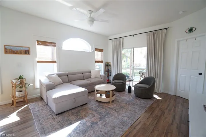 Living area featuring wood finished floors and ceiling fan
