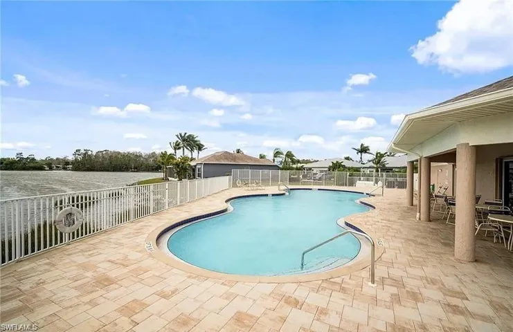 Community pool with a patio area