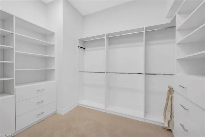 Primary walk-in closet with custom built-ins.