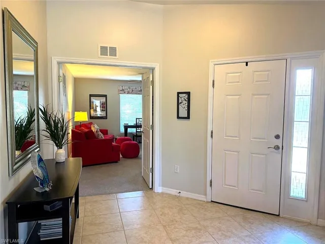 Large Foyer area with side-light window at door